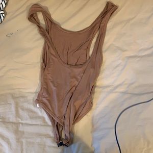 Brown body suit with side boob and low back